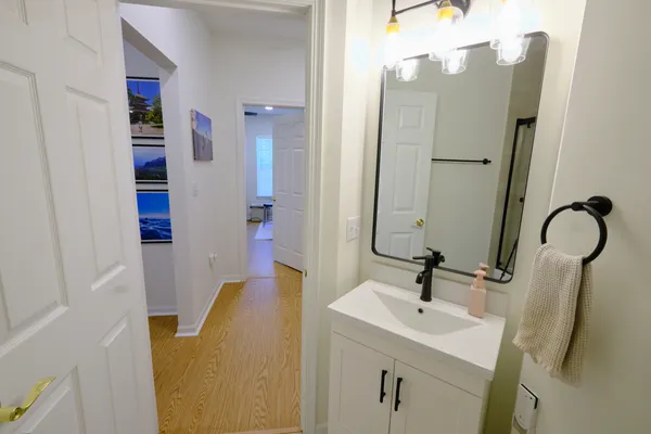 a bathroom with a sink and a mirror