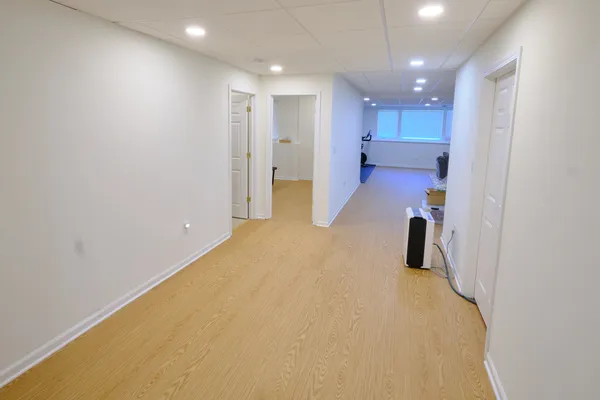 a view of a big room with a refrigerator