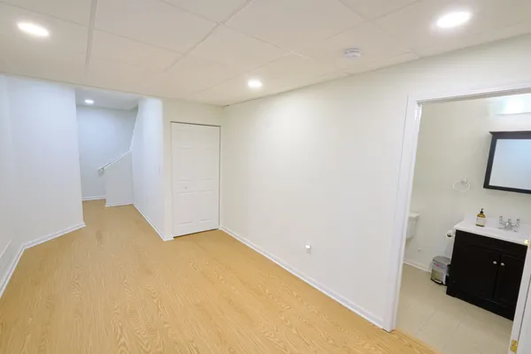 a bedroom with a bed and a tv
