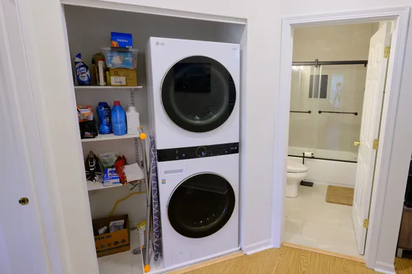 a living room with a washer and dryer
