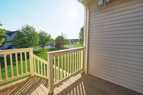 a view of balcony with wooden floor
