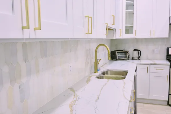 a kitchen with a sink and a window
