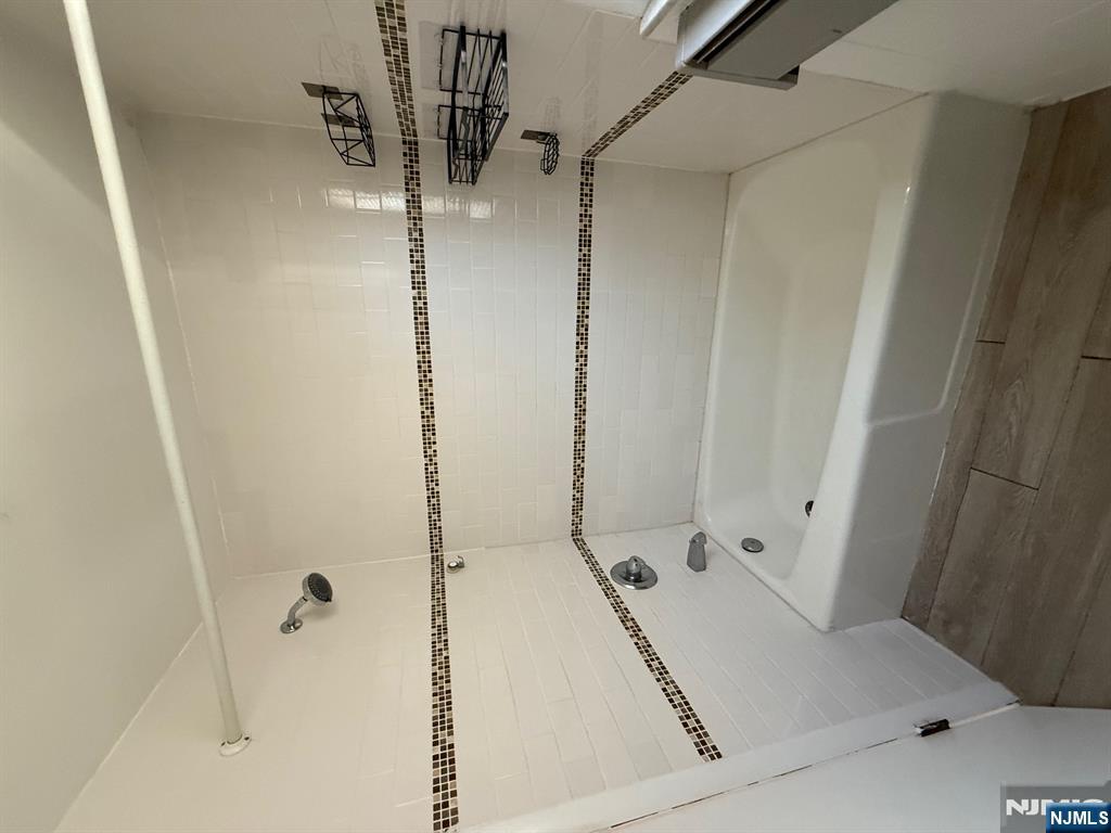 618 8th Street, Unit 2 Lyndhurst, NJ 07071 - Photo 5 of 10 a bathroom with a bathtub and a shower