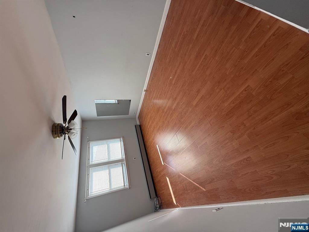 618 8th Street, Unit 2 Lyndhurst, NJ 07071 - Photo 6 of 10 a view of empty room with wooden floor and fan