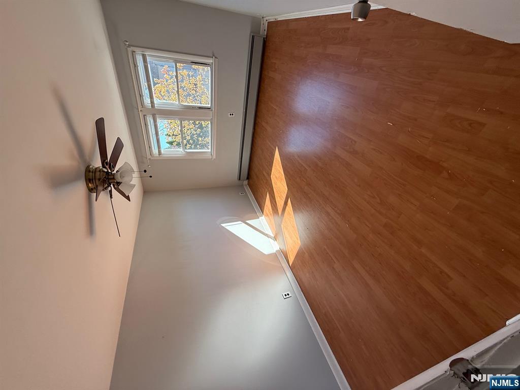 618 8th Street, Unit 2 Lyndhurst, NJ 07071 - Photo 9 of 10 en empty room with windows and ceiling fan