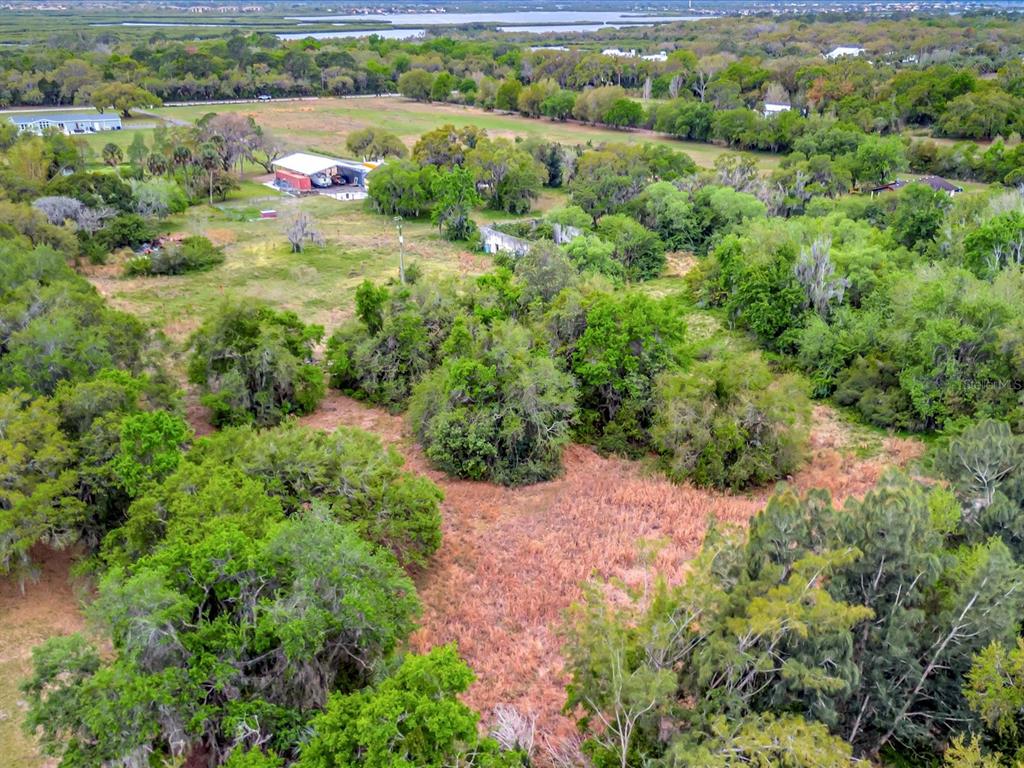 9120 25th Street East Parrish, FL 34219 - Photo 14 of 28 an aerial view of residential house with outdoor space and trees