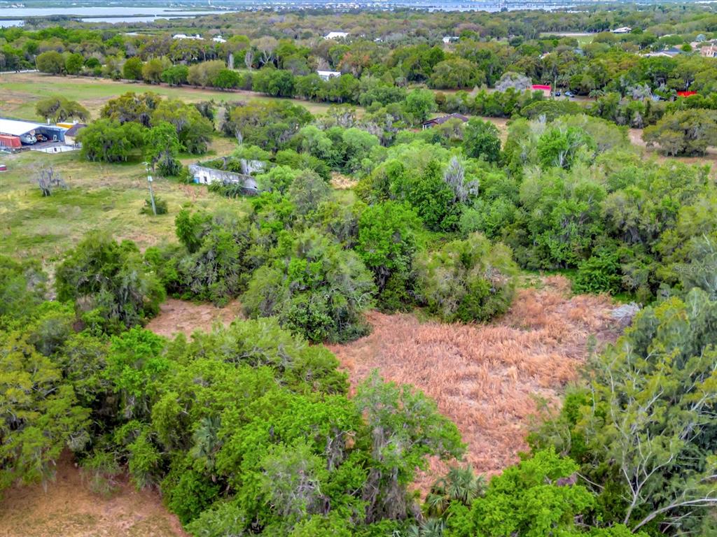 9120 25th Street East Parrish, FL 34219 - Photo 15 of 28 an aerial view of residential house with outdoor space and trees all around
