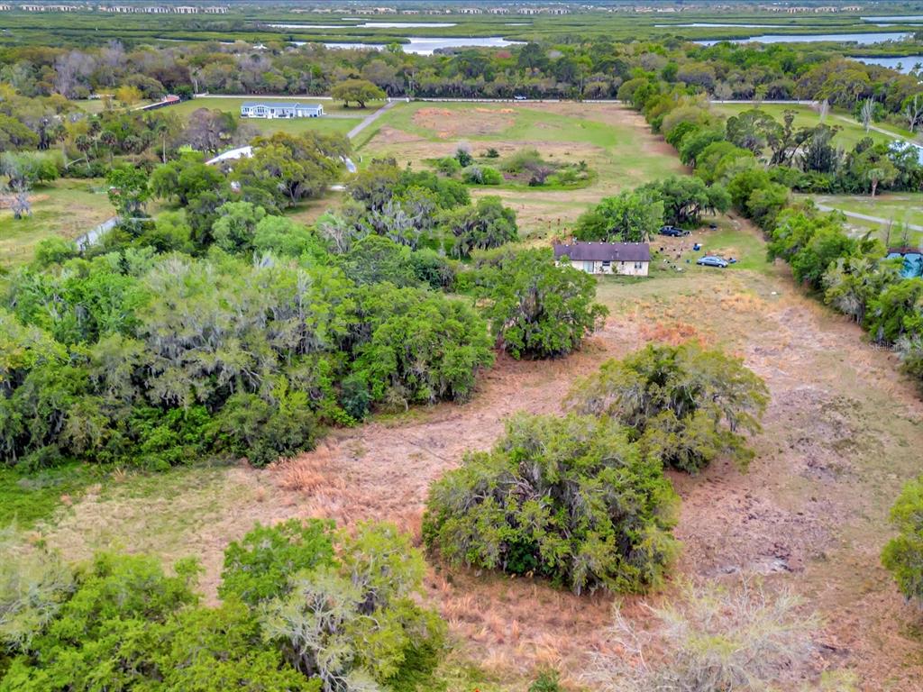 9120 25th Street East Parrish, FL 34219 - Photo 18 of 28 an aerial view of residential houses with outdoor space and river