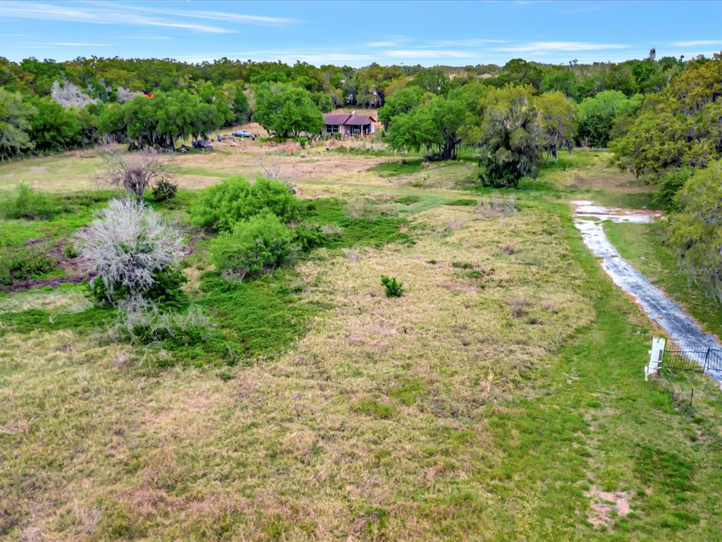 9120 25th Street East Parrish, FL 34219 - Photo 24 of 28 a view of a pathway with a garden