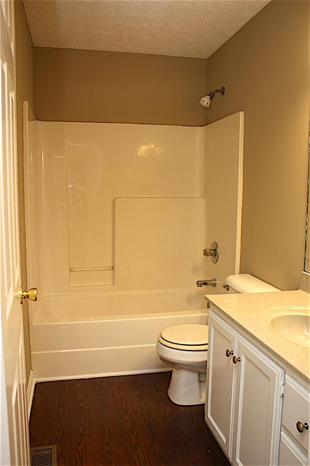 327 Bandera Lane Springfield, TN 37172 - Photo 9 of 11 a bathroom with a granite countertop sink toilet and shower