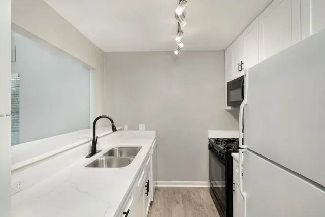 a bathroom with a sink and mirror