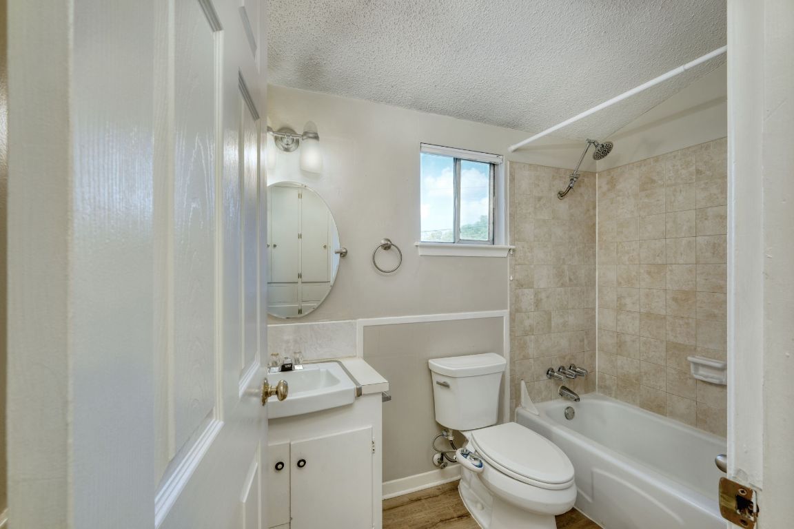 2711 St Edwards Circle, Unit 2 Austin, TX 78704 - Photo 10 of 17 Full bath featuring shower / tub combination, vanity, and a textured ceiling