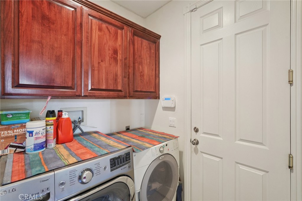 30810 Avenida Del Reposo Temecula, CA 92591 - Photo 15 of 75 a utility room with dryer and washer