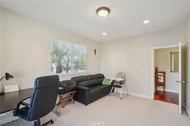 a bathroom with a granite countertop sink a large mirror and a shower