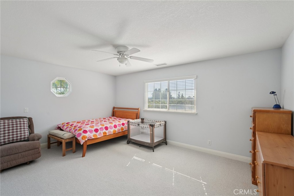 30810 Avenida Del Reposo Temecula, CA 92591 - Photo 22 of 75 a bedroom with bed and window