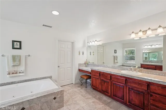 an aerial view of a house with a yard and balcony