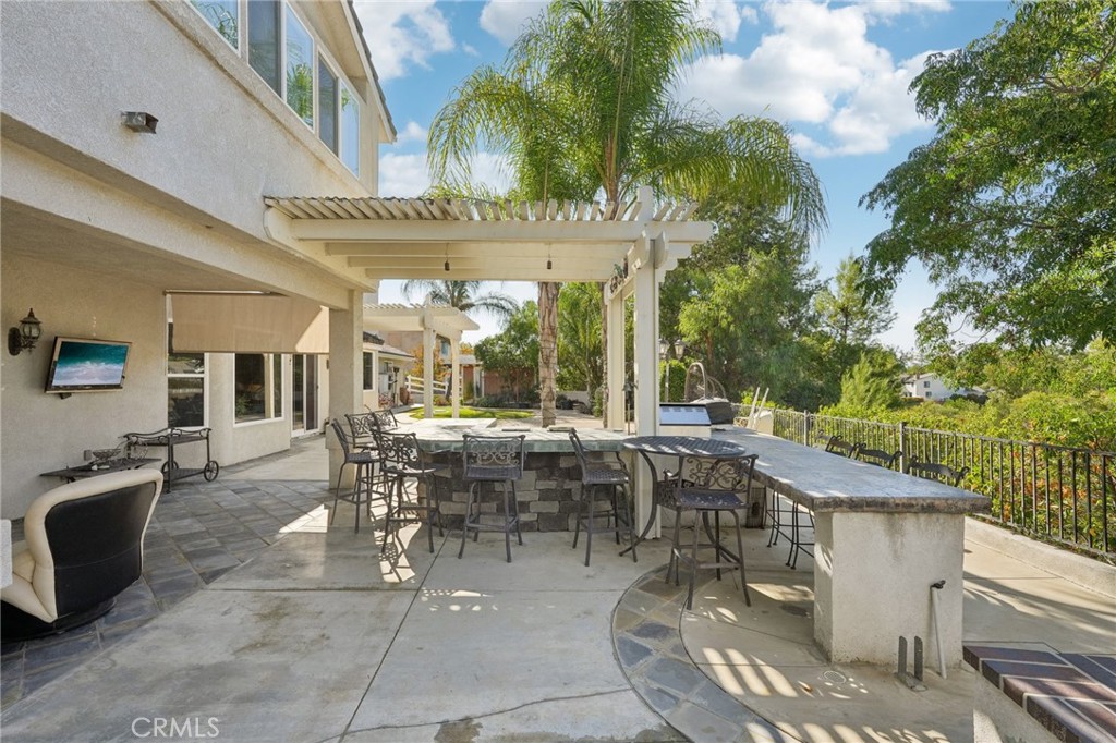 30810 Avenida Del Reposo Temecula, CA 92591 - Photo 37 of 75 a view of a patio with table and chairs and potted plants