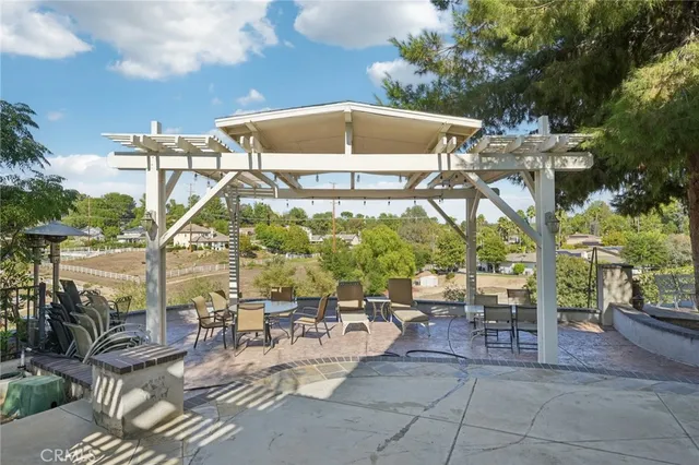 a view of a swimming pool with a patio