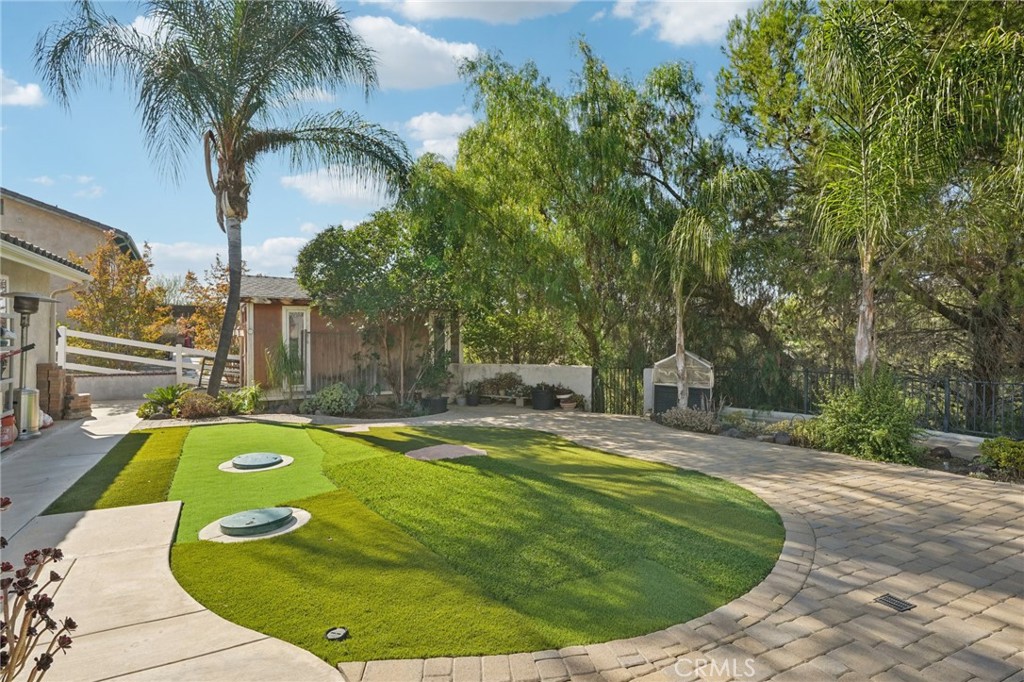 30810 Avenida Del Reposo Temecula, CA 92591 - Photo 41 of 75 a swimming pool with outdoor seating and yard