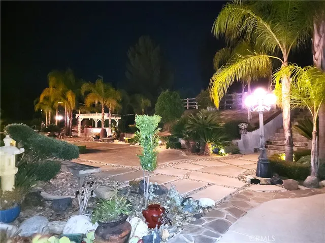 a view of a swimming pool with a yard and mountain view