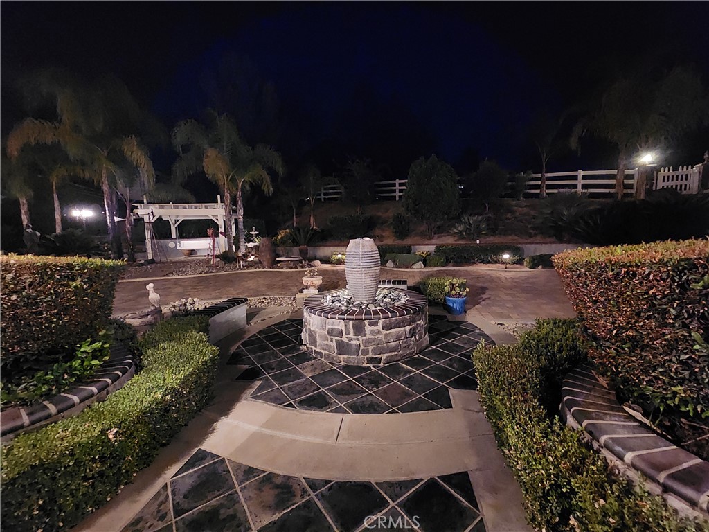 30810 Avenida Del Reposo Temecula, CA 92591 - Photo 59 of 75 a view of a yard of the house and fire pit