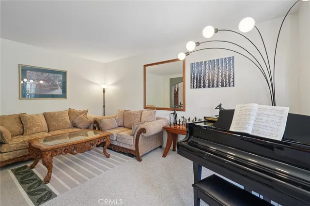 a kitchen with stainless steel appliances granite countertop wooden cabinets a center island and a window