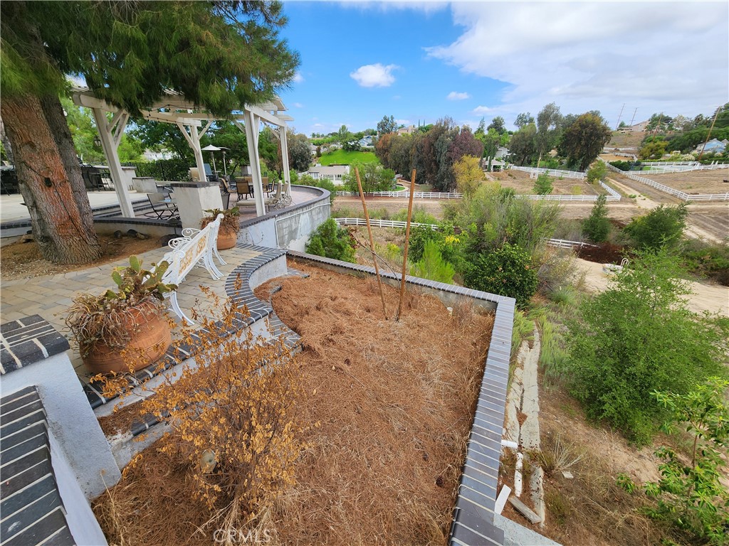 30810 Avenida Del Reposo Temecula, CA 92591 - Photo 63 of 75 a view of a swimming pool with a yard and mountain view