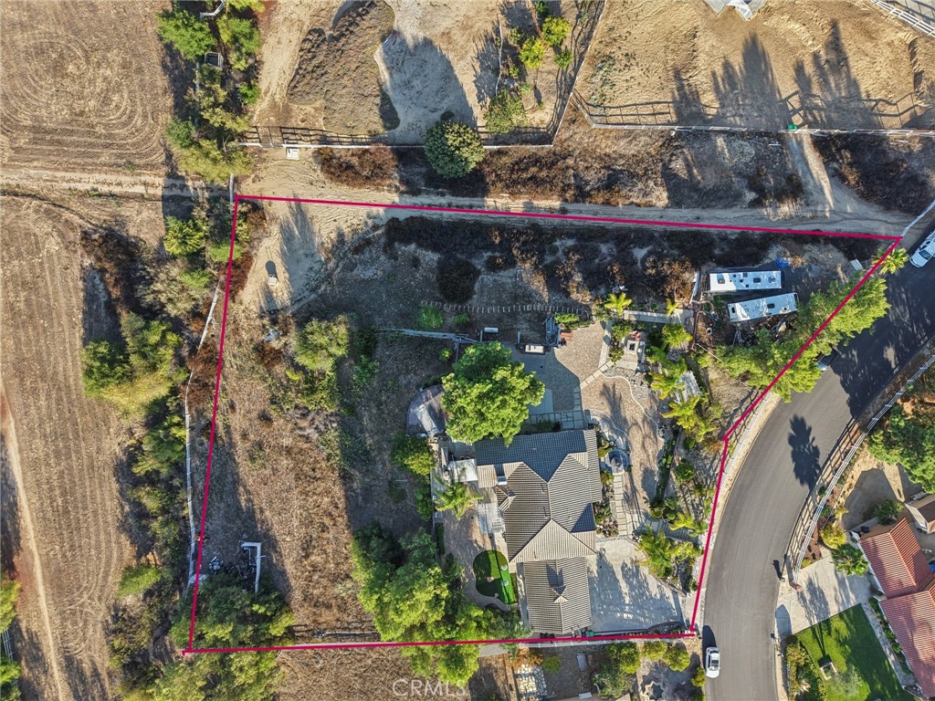 30810 Avenida Del Reposo Temecula, CA 92591 - Photo 69 of 75 an aerial view of a house with a yard and large trees