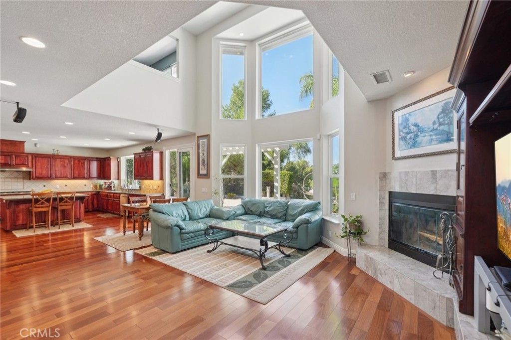 30810 Avenida Del Reposo Temecula, CA 92591 - Photo 8 of 75 a living room with furniture and a fireplace