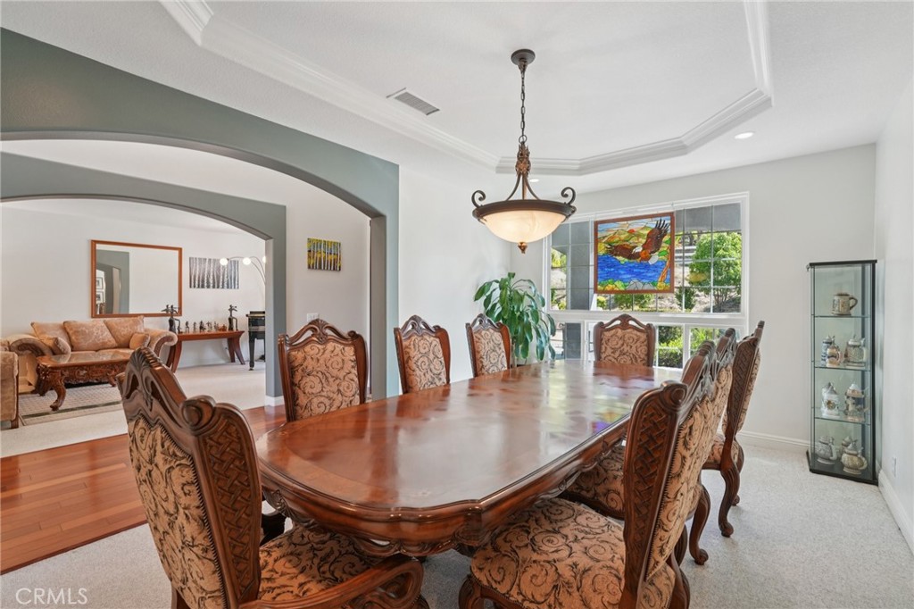 30810 Avenida Del Reposo Temecula, CA 92591 - Photo 9 of 75 a dining room with furniture a chandelier and wooden floor