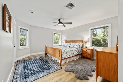 a bed room with a bed and a window