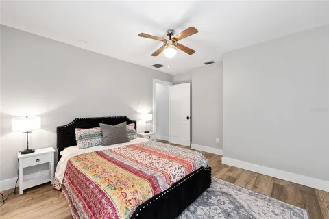a bedroom with bed and window