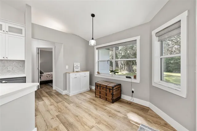 a spacious bedroom with a bed and a window