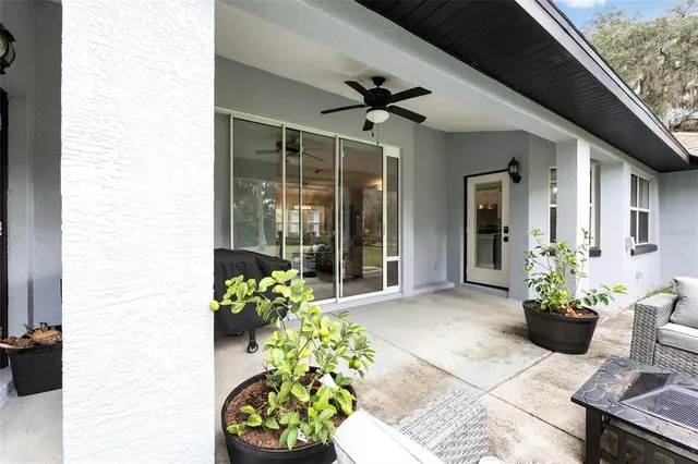 a front view of a house with outdoor seating