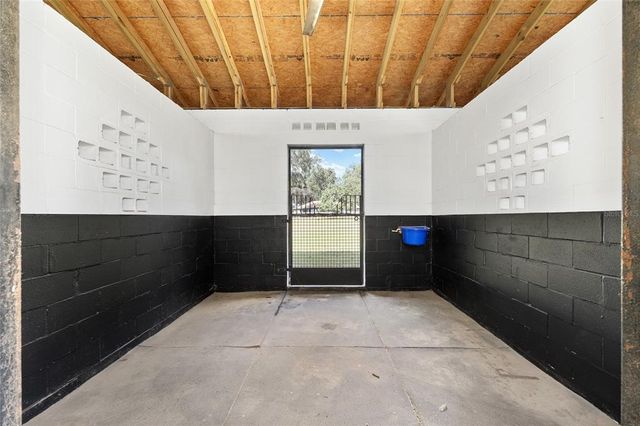 a view of a livingroom with furniture and a window