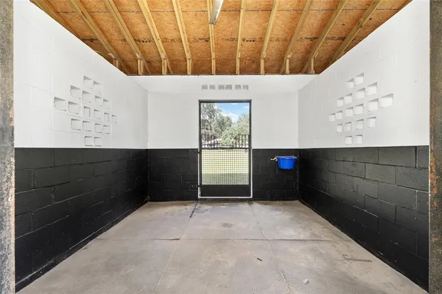a view of a livingroom with furniture and a window
