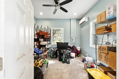 a view of a house with backyard porch and sitting area