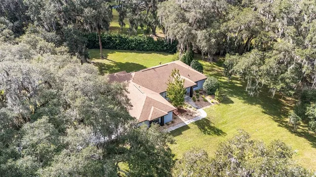 a view of a pool with a yard