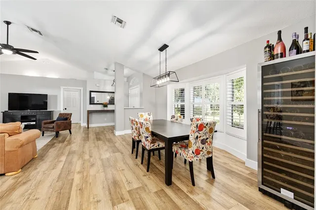 a view of a dining room with furniture window and wooden floor