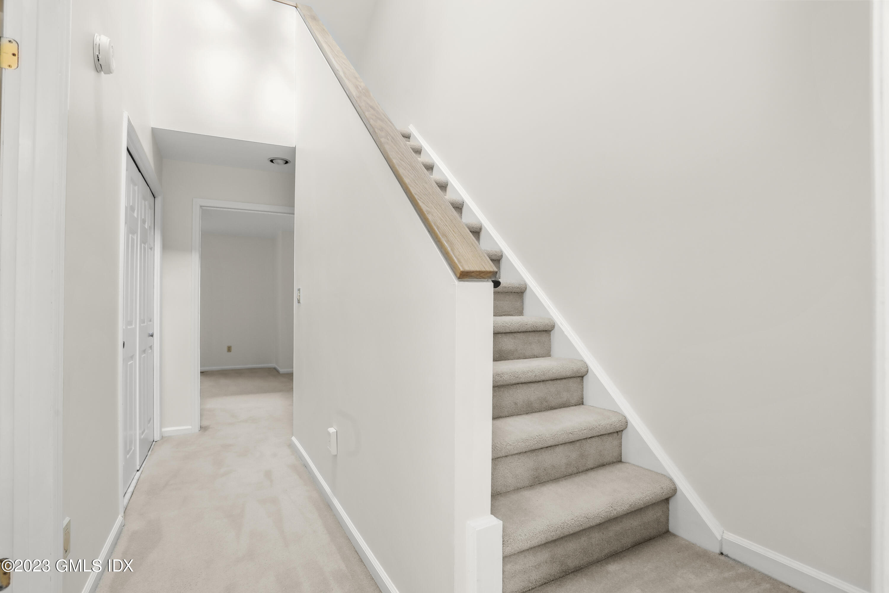 5 Glen Street, Unit 101 Greenwich, CT 06830 - Photo 12 of 37 a view of a hallway with staircase