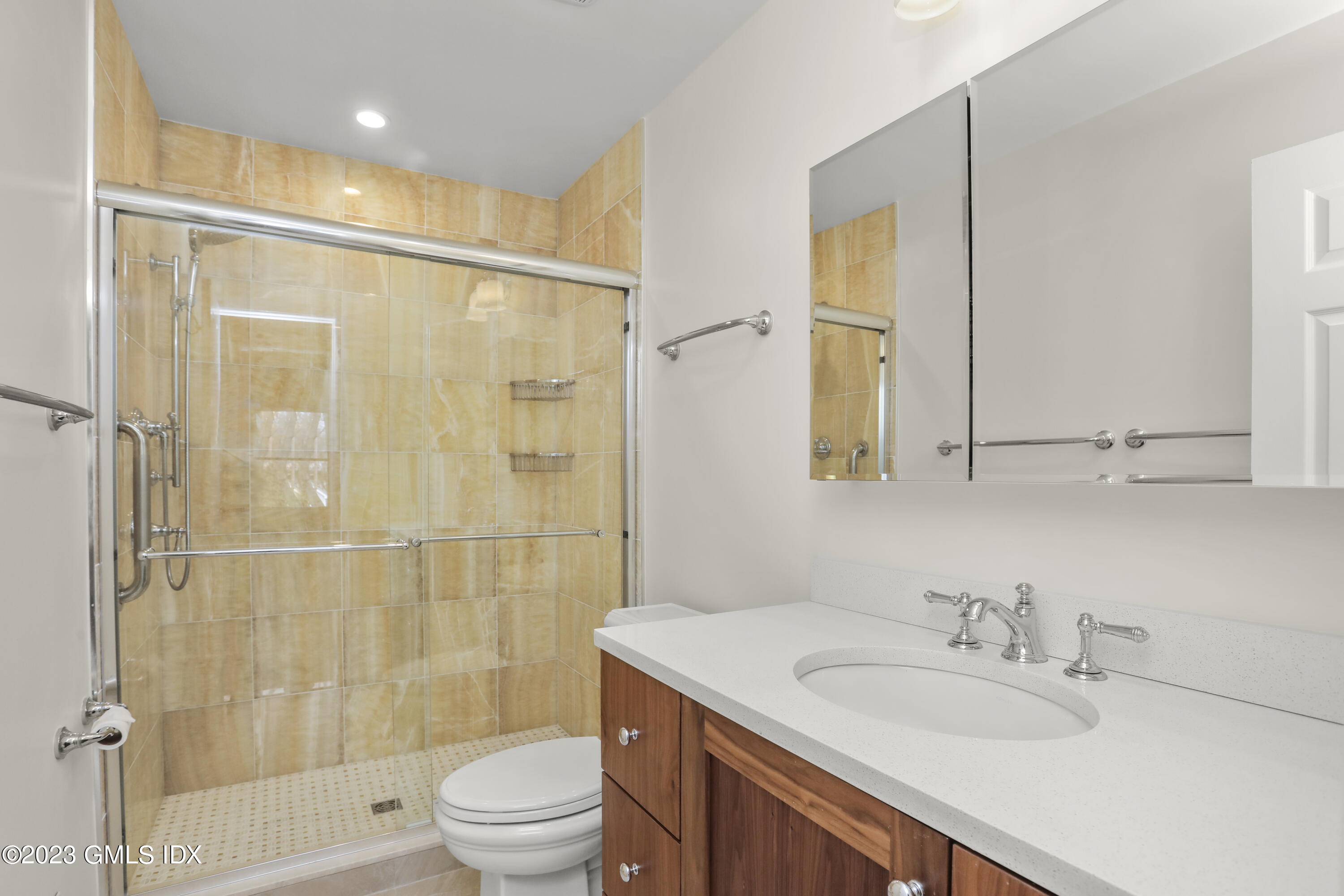 5 Glen Street, Unit 101 Greenwich, CT 06830 - Photo 16 of 37 a bathroom with a sink a toilet and shower