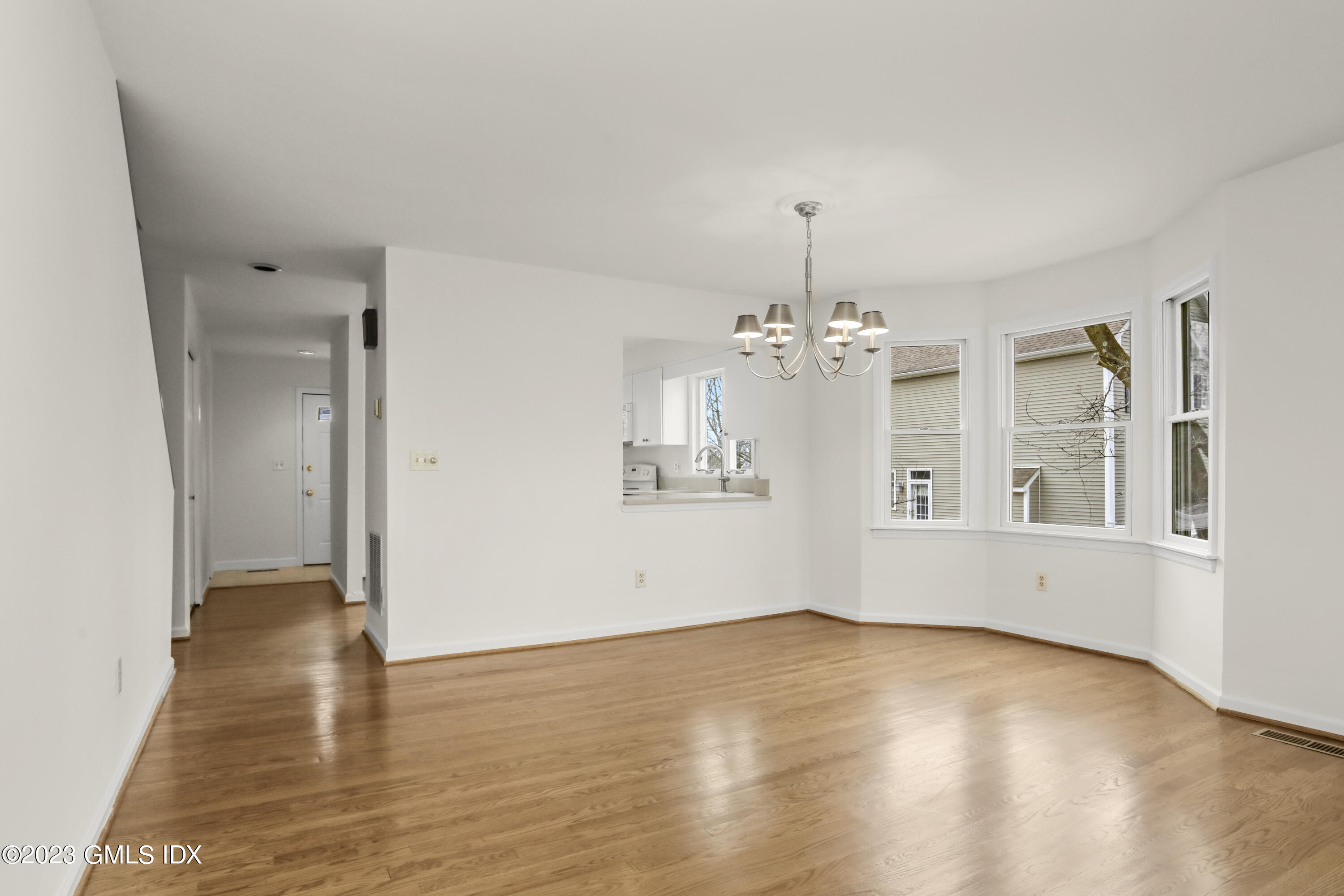 5 Glen Street, Unit 101 Greenwich, CT 06830 - Photo 3 of 37 wooden floor in an empty room with a window