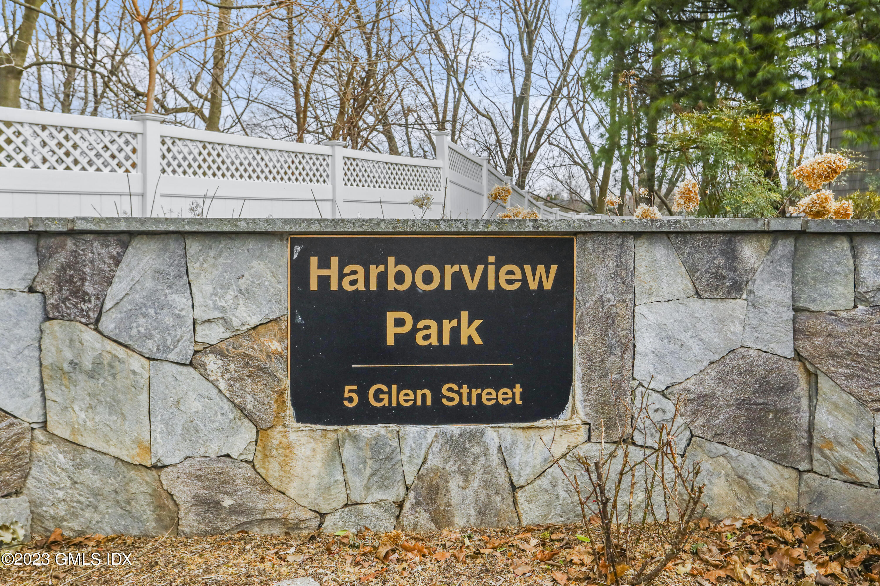 5 Glen Street, Unit 101 Greenwich, CT 06830 - Photo 31 of 37 a sign broad on wooden wall