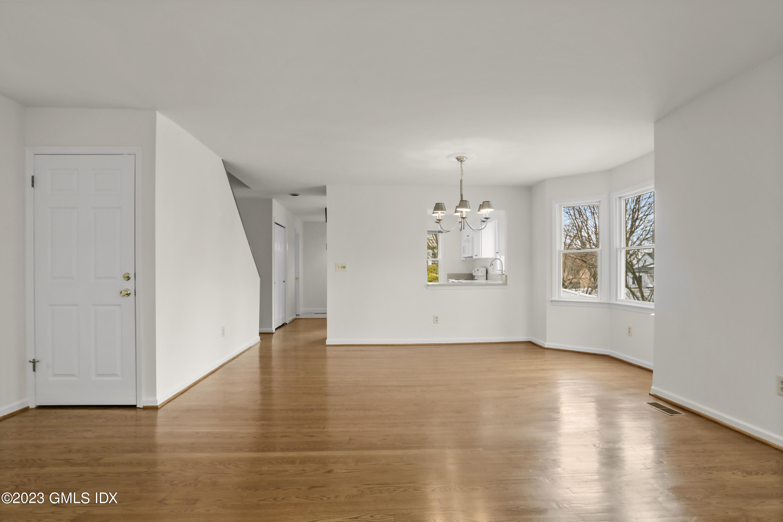 5 Glen Street, Unit 101 Greenwich, CT 06830 - Photo 7 of 37 a view of an empty room with window and wooden floor