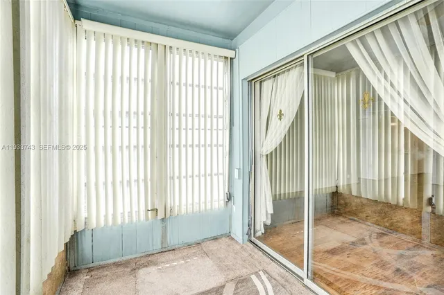 a view of a room that has a large window