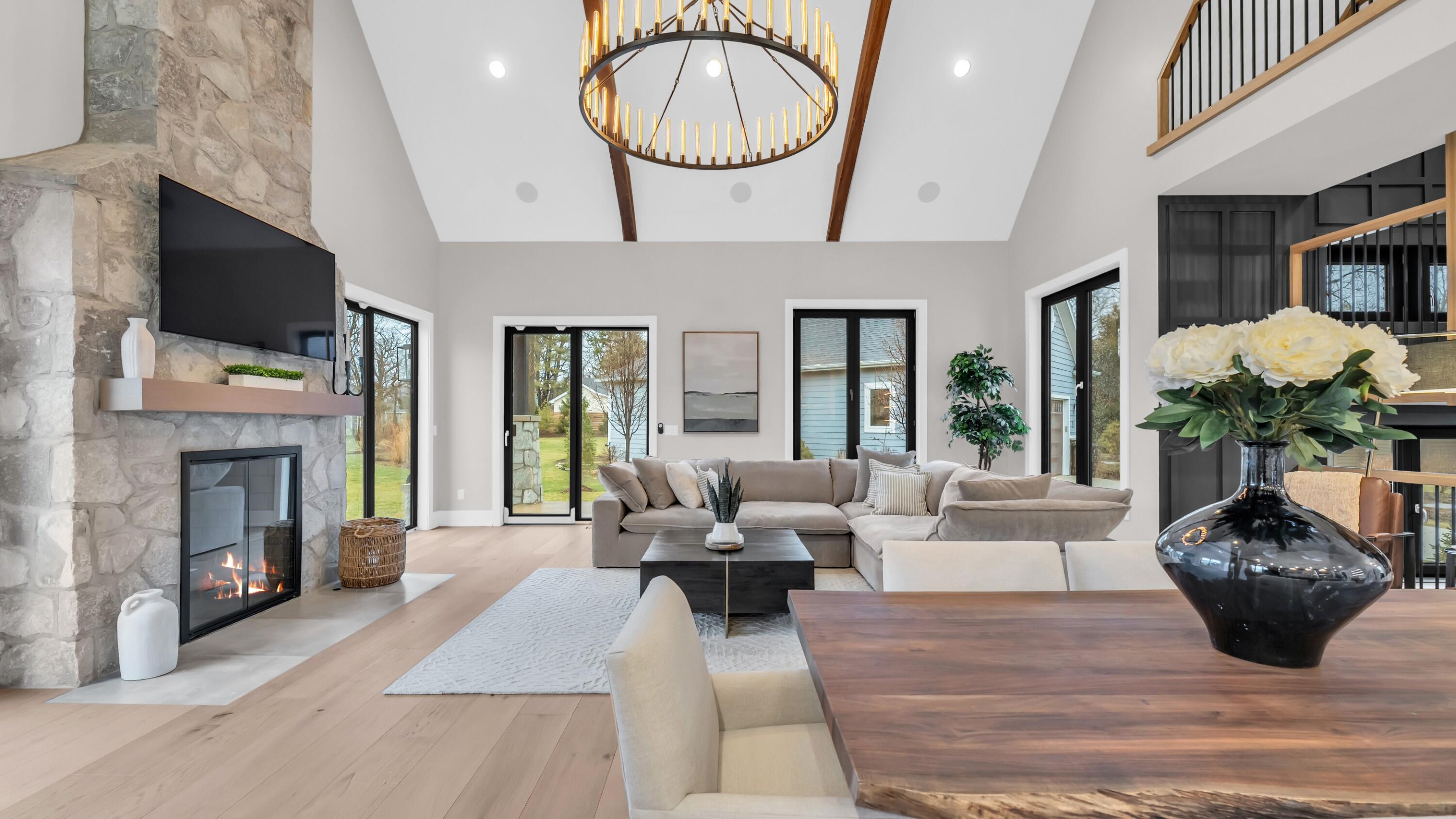 The great room offers a stunning bright living space with a floor to ceiling fireplace (fire is virtually enhanced)