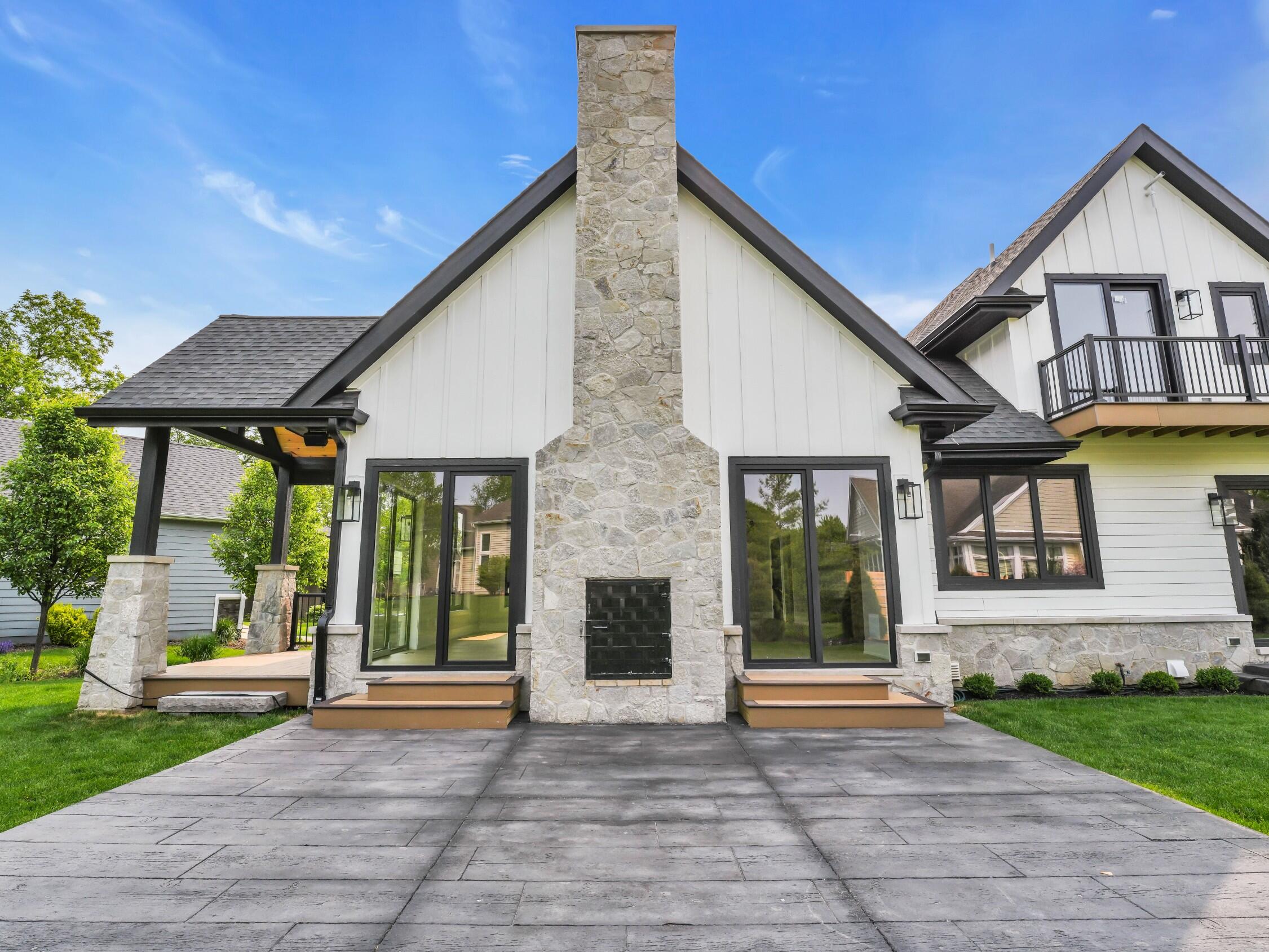 525 Maple Street Lake Geneva, WI 53147 - Photo 64 of 70 Wonderful pattern concrete patio with full wood burning fireplace access to the exterior.