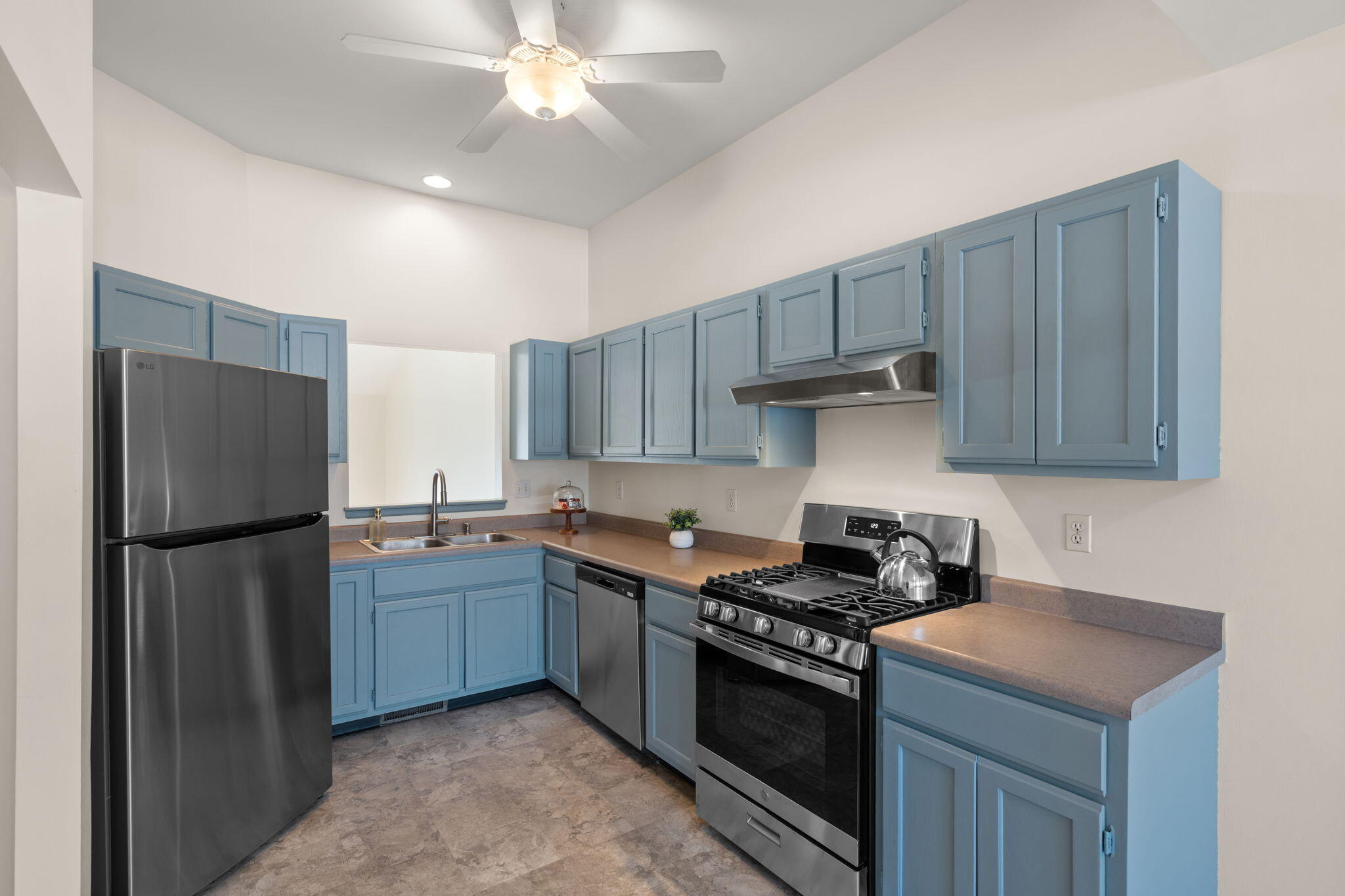 1995 Texas Street Chesterton, IN 46304 - Photo 7 of 28 a kitchen with stainless steel appliances granite countertop a stove a refrigerator and a sink