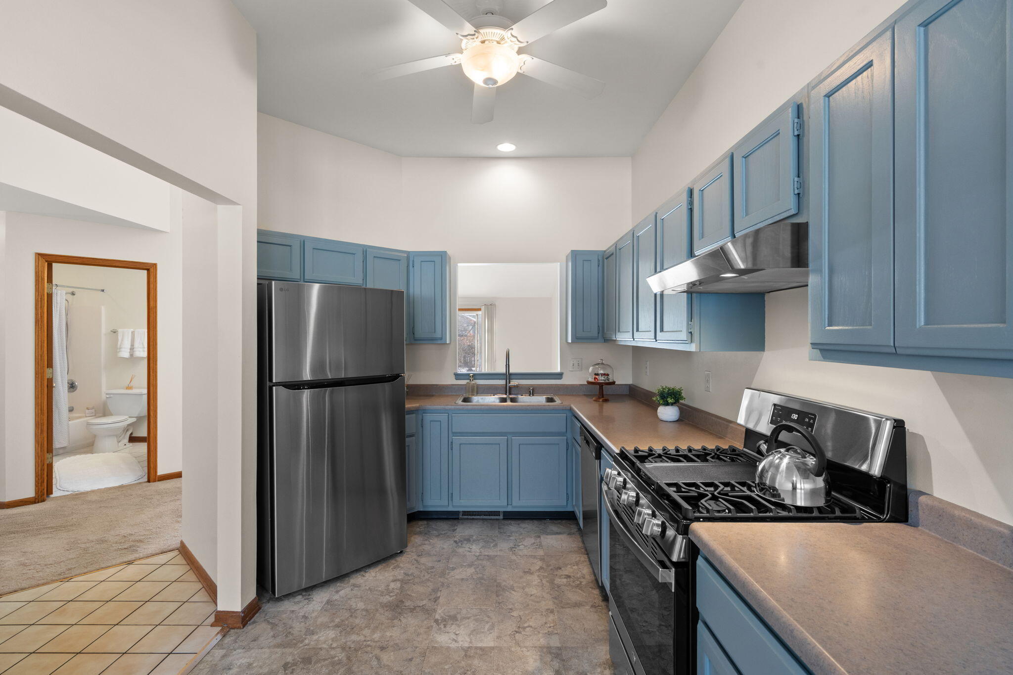 1995 Texas Street Chesterton, IN 46304 - Photo 8 of 28 a kitchen with stainless steel appliances granite countertop a stove top oven a refrigerator a sink and dishwasher