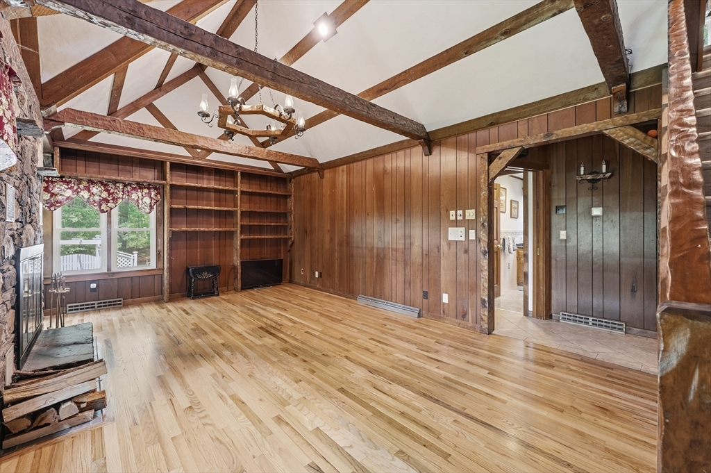 43 Flint Road Tyngsborough, MA 01879 - Photo 11 of 40 a view of a livingroom with wooden floor and a window